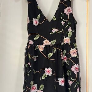Urban Outfitters dressy Black with colored flowers romper. Size M